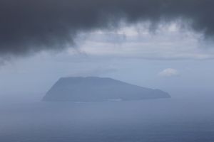 the little neighbouring Island of Corvo appears below a rain cloud
